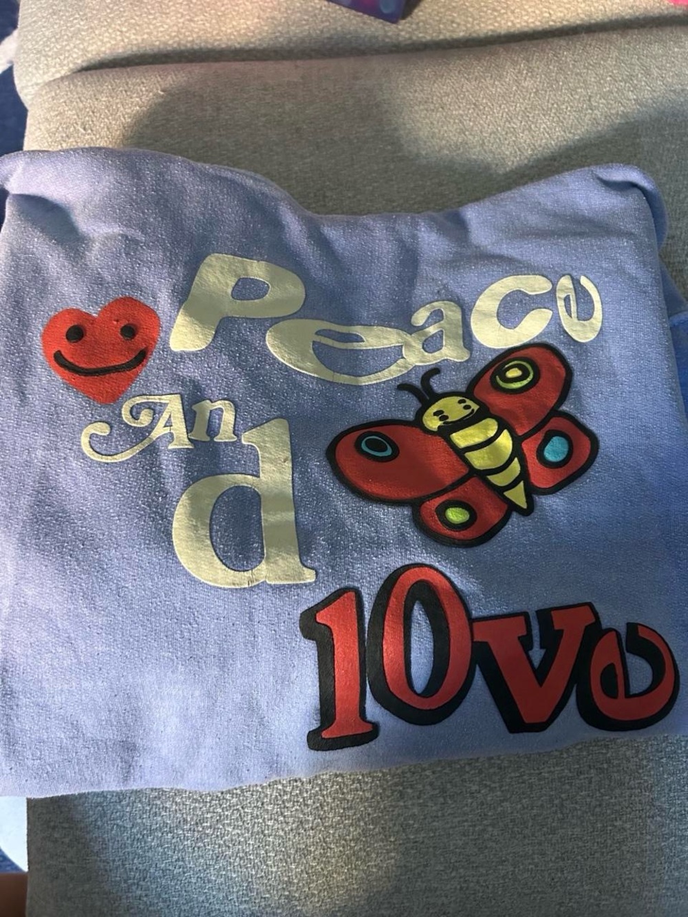 Light Blue Graphic Sweatshirt with Colorful Butterfly & Peace Design
